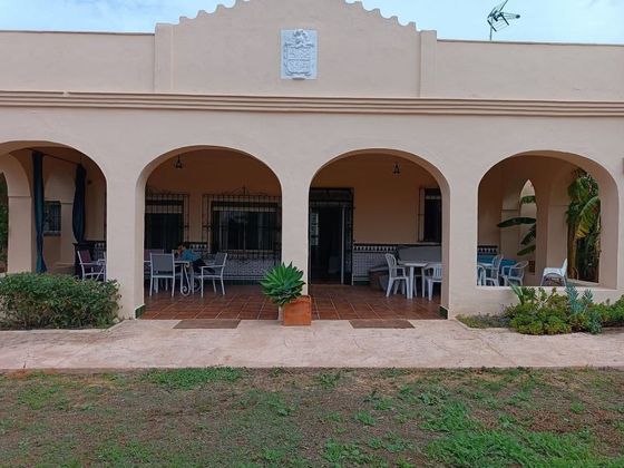 Foto 1 de Casa rural en venda a Sanlúcar la Mayor de 7 habitacions amb terrassa i piscina