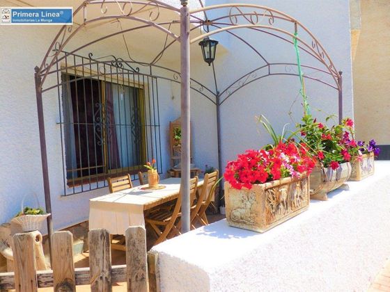 Foto 1 de Casa adossada en venda a Cabo de Palos de 4 habitacions amb piscina i jardí