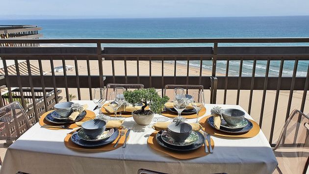 Foto 1 de Piso en venta en Playa de Gandia de 4 habitaciones con terraza y piscina