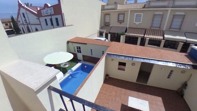Foto 1 de Venta de casa adosada en Rinconada (La) de 4 habitaciones con terraza y piscina