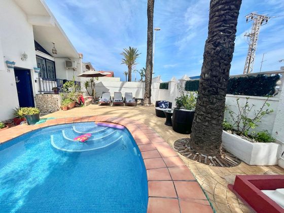 Foto 2 de Venta de casa adosada en avenida La Manga de 4 habitaciones con terraza y piscina