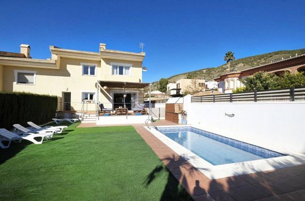 Foto 1 de Casa en venda a urbanización El Puntal G de 4 habitacions amb terrassa i piscina