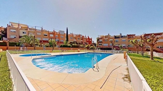 Foto 1 de Venta de casa adosada en calle De Lebrija de 5 habitaciones con terraza y piscina