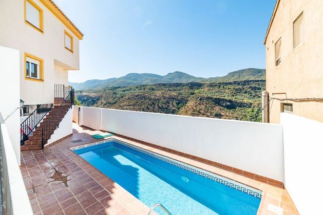 Foto 1 de Venta de casa adosada en Albuñuelas de 2 habitaciones con terraza y piscina