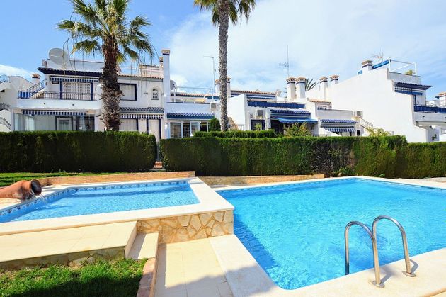Foto 1 de Venta de casa adosada en Campos de Golf - Villa Martin - Los Dolses de 3 habitaciones con terraza y piscina
