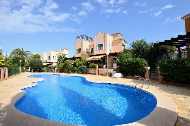 Foto 1 de Casa adossada en venda a Los Balcones - Los Altos del Edén de 4 habitacions amb terrassa i piscina
