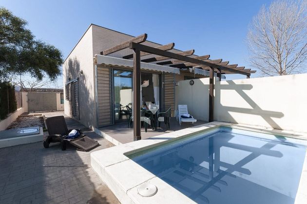 Foto 1 de Venta de chalet en Oliva Nova de 2 habitaciones con terraza y piscina