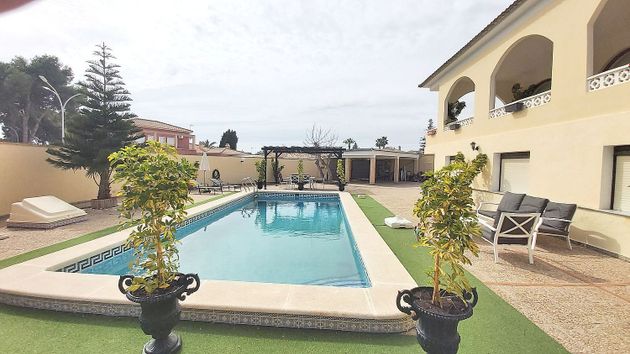 Foto 1 de Venta de chalet en Dehesa de Campoamor - La Regia - Aguamarina de 5 habitaciones con terraza y piscina