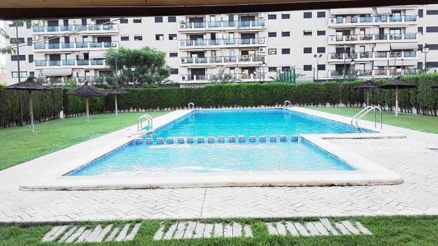 Foto 1 de Pis en venda a Playa del Puig de 3 habitacions amb piscina i garatge