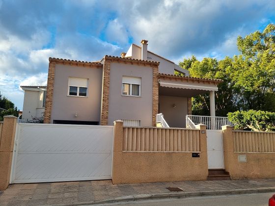 Foto 1 de Chalet en venta en Oliva Playa de 6 habitaciones con terraza y piscina