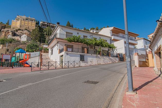 Foto 1 de Venta de casa en calle Alfaguara de 9 habitaciones con terraza y garaje