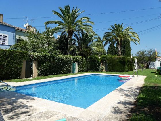Foto 1 de Casa adosada en venta en Rocafort de 4 habitaciones con terraza y piscina