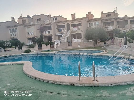 Foto 1 de Casa adosada en venta en calle Camilo Jose Cela de 4 habitaciones con terraza y piscina