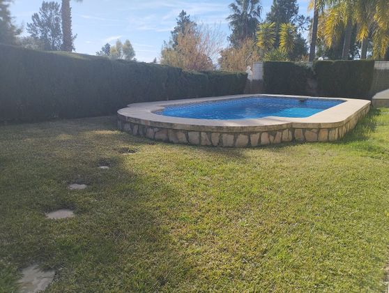 Foto 2 de Venta de casa adosada en Oliva Nova de 3 habitaciones con terraza y piscina