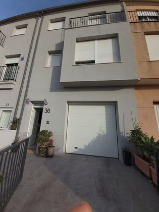 Foto 1 de Venta de casa adosada en Riola de 4 habitaciones con terraza y garaje