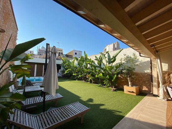 Foto 1 de Casa adossada en venda a Benifaió de 4 habitacions amb terrassa i piscina