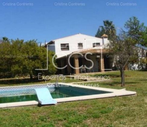 Foto 1 de Venta de casa rural en Sanlúcar la Mayor de 9 habitaciones con piscina y jardín