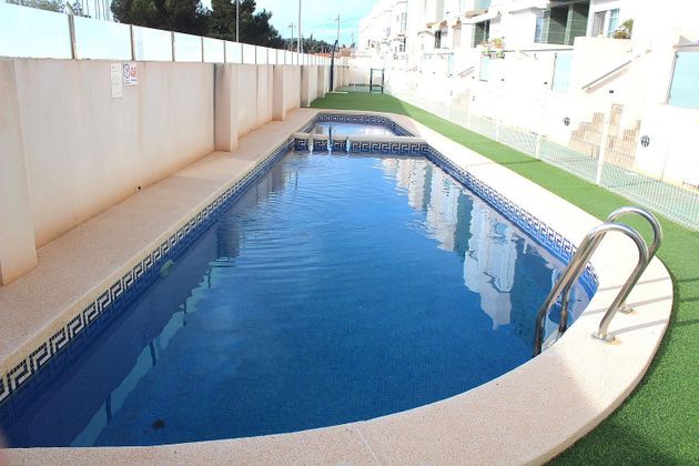 Foto 1 de Casa adosada en venta en El Algar de 3 habitaciones con terraza y piscina