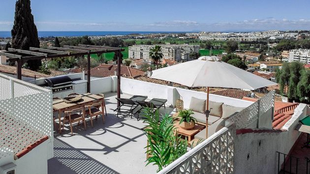 Foto 1 de Casa adosada en venta en calle Nueva Andalucia Las Brisas de 4 habitaciones con terraza y piscina
