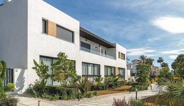 Foto 1 de Casa adosada en venta en calle Marein Villagenueva Andalucia de 3 habitaciones con terraza y piscina