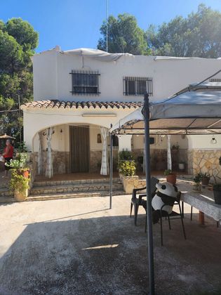 Foto 1 de Venta de chalet en calle De la Isleta de 5 habitaciones con terraza y piscina