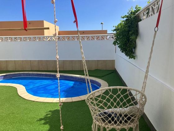 Foto 1 de Venta de casa adosada en Corralejo de 3 habitaciones con piscina