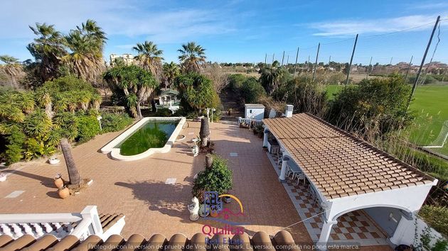 Foto 1 de Venta de casa en Oliva Nova de 3 habitaciones con terraza y piscina