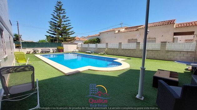 Foto 2 de Casa adosada en alquiler en Oliva Playa de 2 habitaciones con terraza y piscina