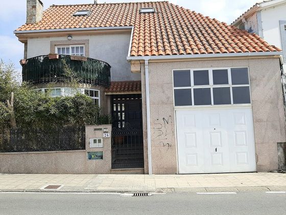 Foto 1 de Xalet en venda a calle Celso Emilio Ferreiro de 4 habitacions amb terrassa i garatge
