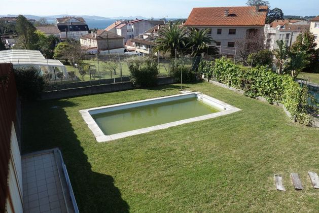 Foto 1 de Casa adosada en venta en Sanxenxo de 5 habitaciones con terraza y piscina