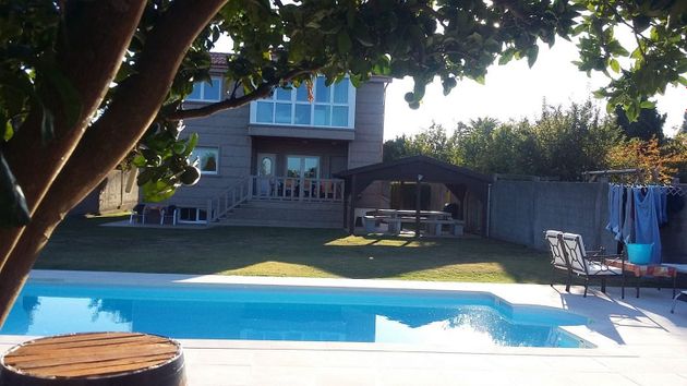Foto 1 de Venta de chalet en Dexo  -Lorbé de 7 habitaciones con terraza y piscina