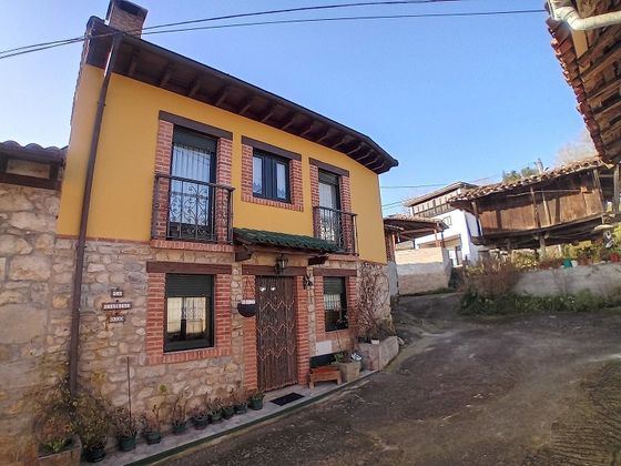 Foto 1 de Venta de casa adosada en calle Mestas de Con de 2 habitaciones con jardín y calefacción