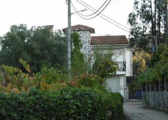 Foto 1 de Casa en venta en Ribadumia de 3 habitaciones con terraza y garaje
