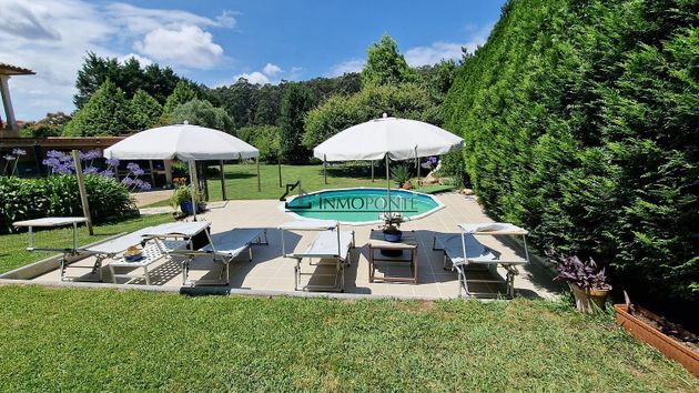 Foto 1 de Xalet en venda a Adina-Portonovo de 5 habitacions amb piscina i jardí