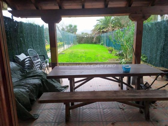 Foto 1 de Casa adossada en venda a Mioño - Santullán de 3 habitacions amb piscina i jardí