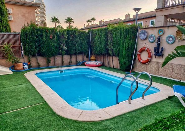 Foto 1 de Chalet en venta en Port d'Alcúdia - Platja d'Alcúdia de 3 habitaciones con terraza y piscina