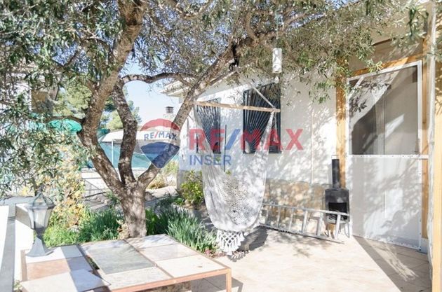 Foto 1 de Chalet en venta en Costa Cunit - Els Jardins - Els  Rosers de 3 habitaciones con piscina y aire acondicionado