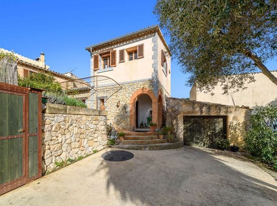 Foto 1 de Casa adossada en venda a Puigpunyent de 4 habitacions amb terrassa i piscina