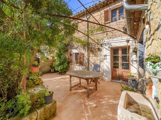 Foto 2 de Casa adossada en venda a Puigpunyent de 4 habitacions amb terrassa i piscina