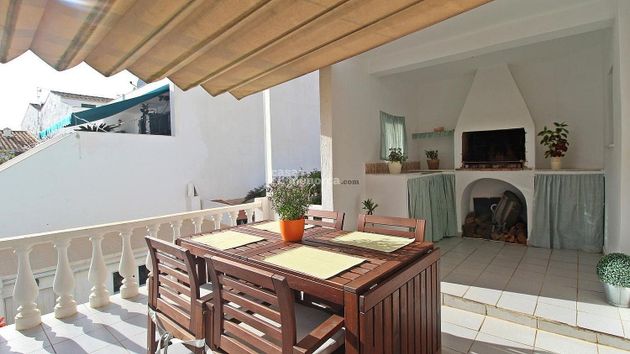 Foto 1 de Venta de casa adosada en Sant Lluís de 6 habitaciones con terraza y garaje