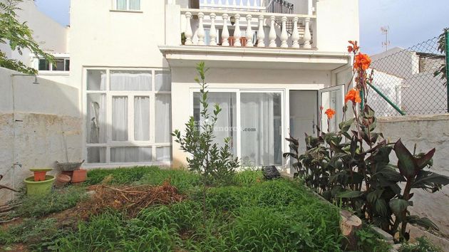 Foto 2 de Casa adossada en venda a Sant Lluís de 6 habitacions amb terrassa i garatge