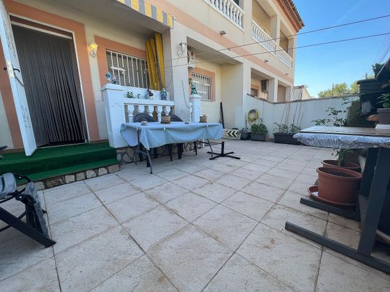 Foto 1 de Casa adosada en venta en avenida Màlaga de 3 habitaciones con terraza y jardín