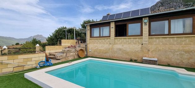 Foto 1 de Venta de casa rural en calle De Gaucin de 3 habitaciones con terraza y piscina