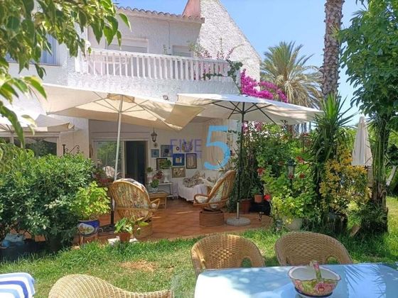 Foto 1 de Casa en venta en Playa de Gandia de 3 habitaciones con terraza y garaje
