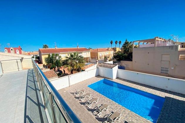 Foto 1 de Xalet en venda a Playa de los Locos de 6 habitacions amb terrassa i piscina