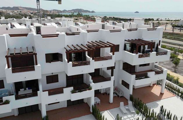 Foto 1 de Venta de piso en San Juan de los Terreros de 2 habitaciones con terraza y piscina