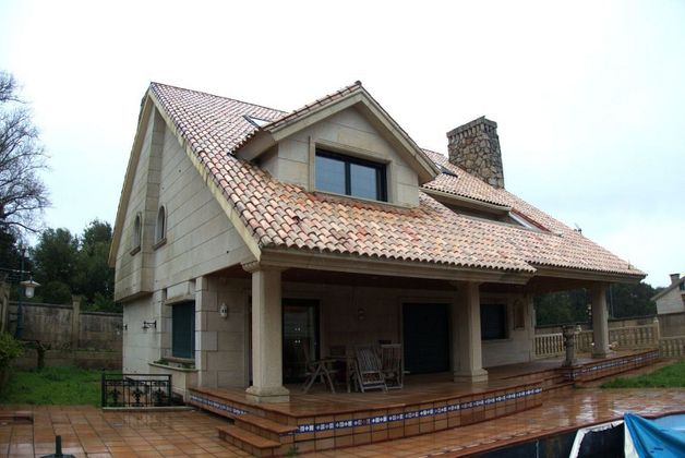 Foto 1 de Venta de casa en Alcabre - Navia - Comesaña de 4 habitaciones con terraza y piscina
