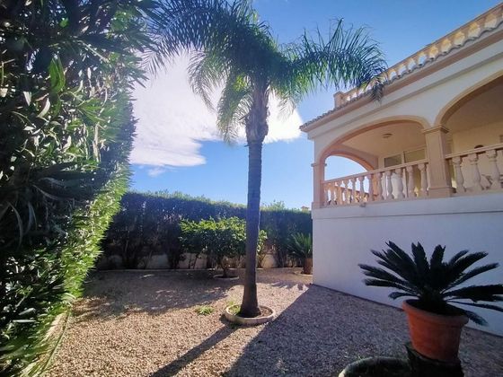 Foto 1 de Chalet en venta en Oliva Playa de 4 habitaciones con terraza y piscina