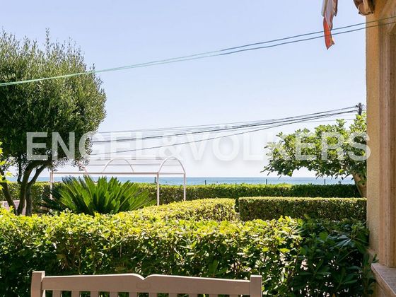Foto 1 de Venta de casa adosada en Playa del Puig de 3 habitaciones con terraza y piscina