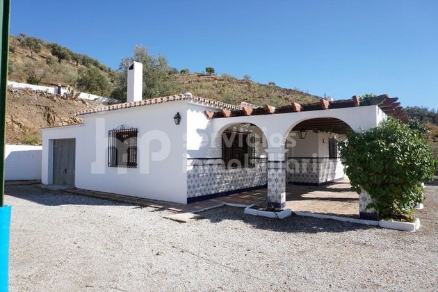 Foto 1 de Casa en venda a Viñuela de 2 habitacions amb piscina i garatge